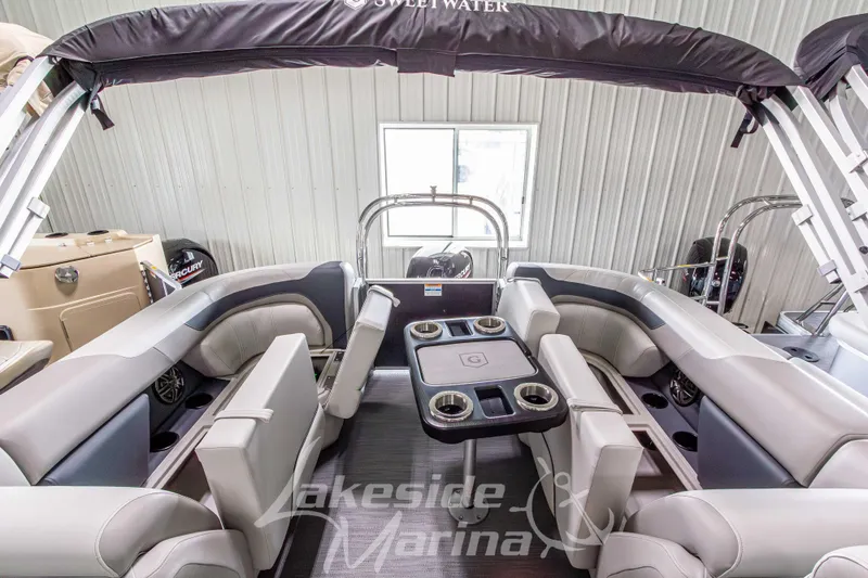 Slide: The Image of Interior view of 2026 Godfrey Sweetwater 2286 SBC pontoon boat with seating and table. - 22