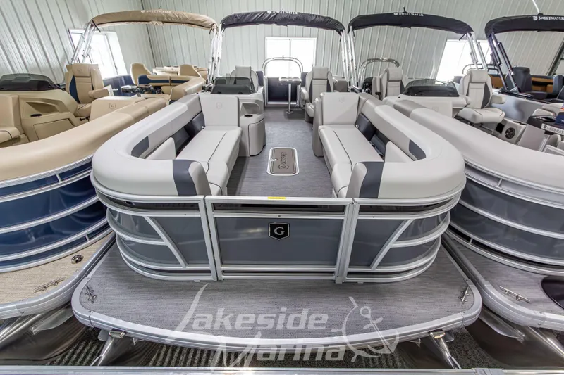 Slide: The Image of 2026 Godfrey Sweetwater 2286 SBC pontoon boat in showroom, featuring spacious seating. - 3