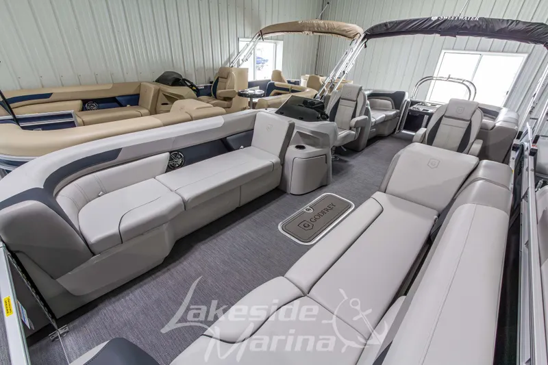 Slide: The Image of 2026 Godfrey Sweetwater 2286 SBC pontoon boat interior with luxurious seating and modern design. - 6