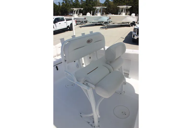 Slide: The Image of 2019 Sea Hunt Ultra 234 boat seat with white cushioned design. - 10
