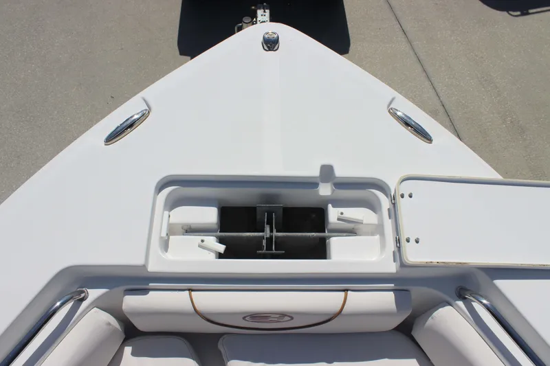 Slide: The Image of Bow view of 2019 Sea Hunt Ultra 234 boat with anchor storage compartment. - 12