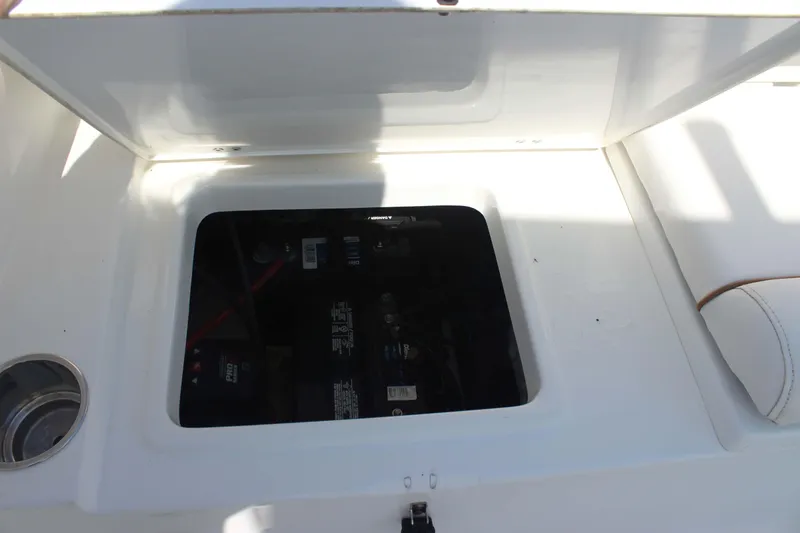 Slide: The Image of Battery compartment of 2019 Sea Hunt Ultra 234 boat, open hatch view. - 18