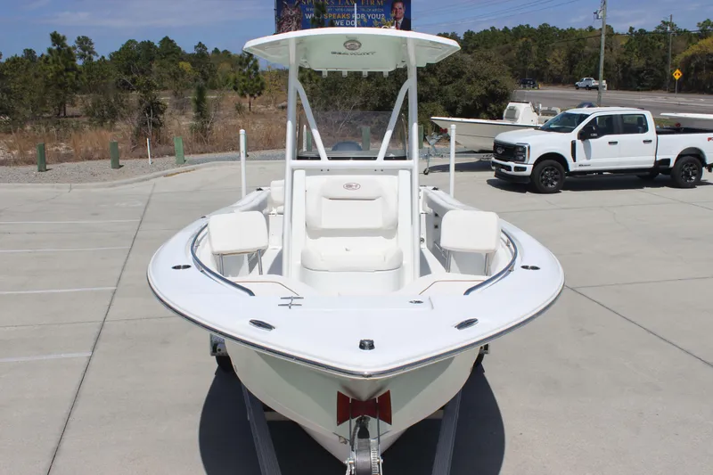 Slide: The Image of 2019 Sea Hunt Ultra 234 boat on trailer, parked in outdoor lot. - 6
