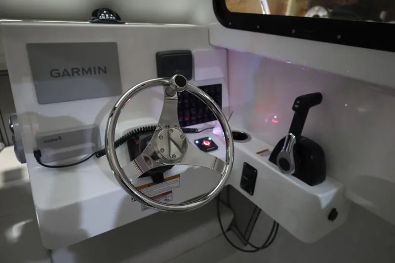 Slide: The Image of Steering console of 2026 Parker 227 Explorer boat with Garmin navigation system. - 12