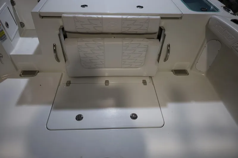 Slide: The Image of 2026 Parker 227 Explorer boat interior with foldable seating and storage compartment. - 15