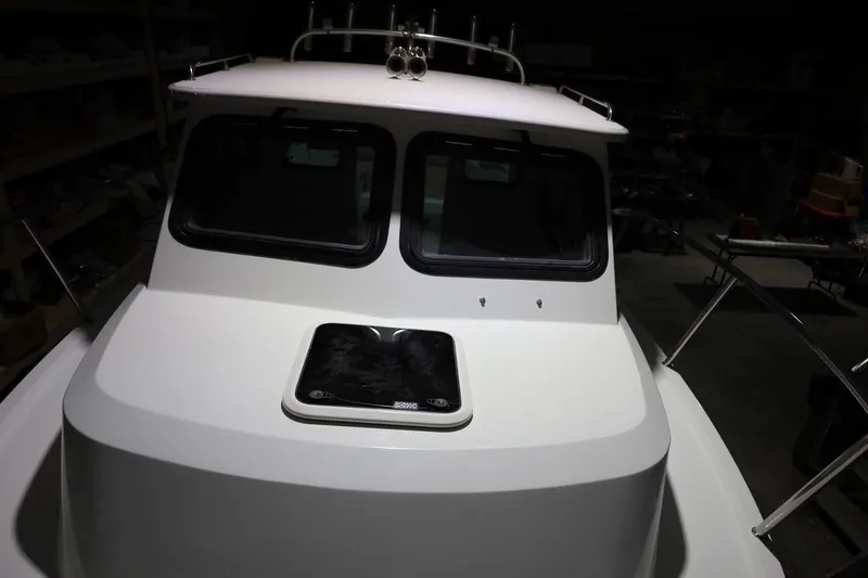 Slide: The Image of 2026 Parker 227 Explorer boat, front view, showcasing sleek design and windows. - 4