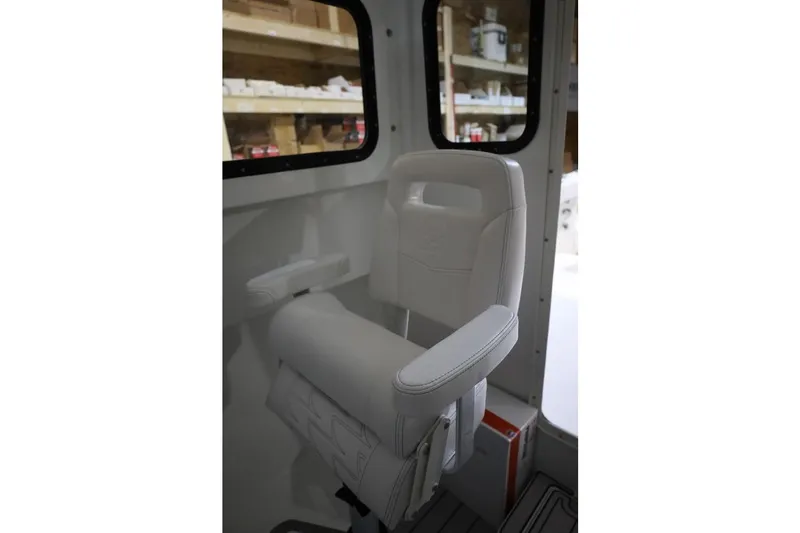 Slide: The Image of White captain's chair inside 2026 Parker 227 Explorer boat cabin. - 8