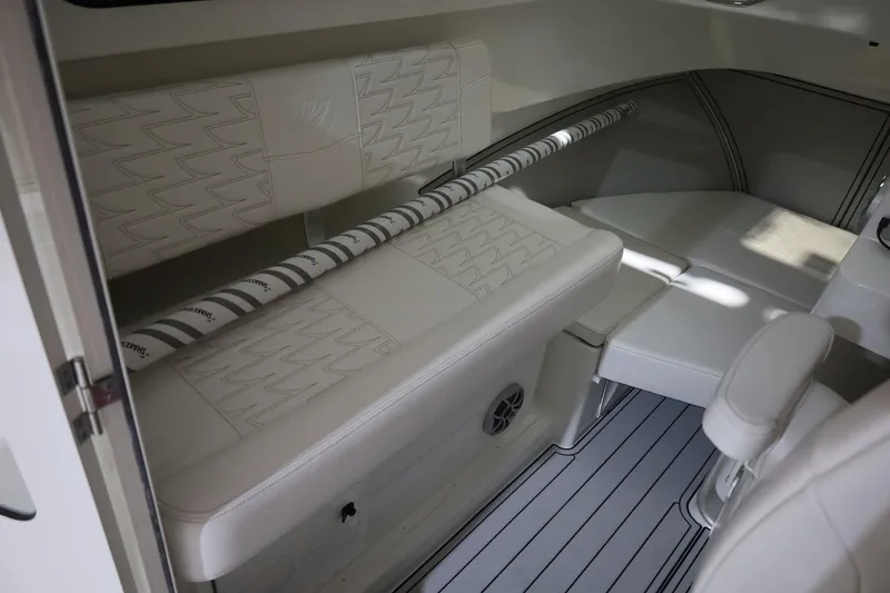 Slide: The Image of Interior of 2026 Parker 227 Explorer boat with white seating and sleek design. - 9