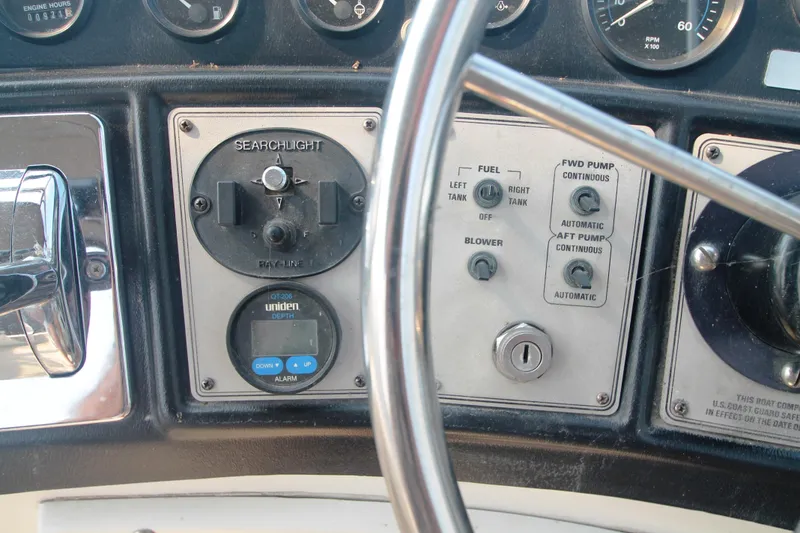 Slide: The Image of Control panel of a 1996 Carver 330 Mariner boat with searchlight and depth gauge. - 19