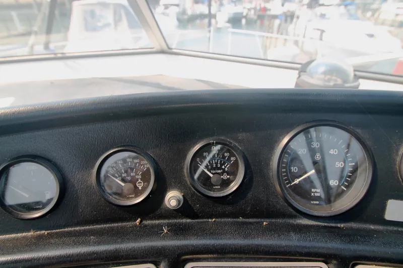 Slide: The Image of Dashboard of a 1996 Carver 330 Mariner boat with gauges and controls. - 21