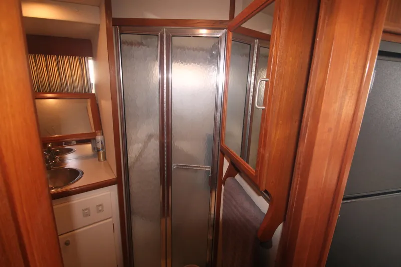 Slide: The Image of Bathroom interior of 1996 Carver 330 Mariner yacht with shower and sink. - 43