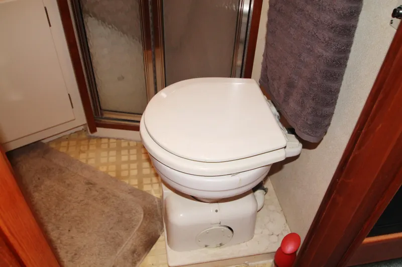 Slide: The Image of Bathroom in 1996 Carver 330 Mariner yacht with toilet and shower. - 45