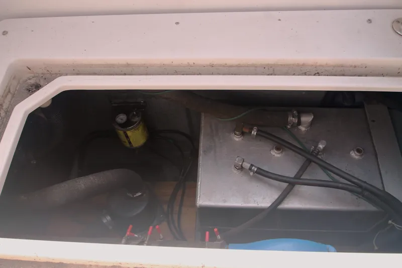Slide: The Image of Engine compartment of a 1996 Carver 330 Mariner boat, showing fuel system components. - 47