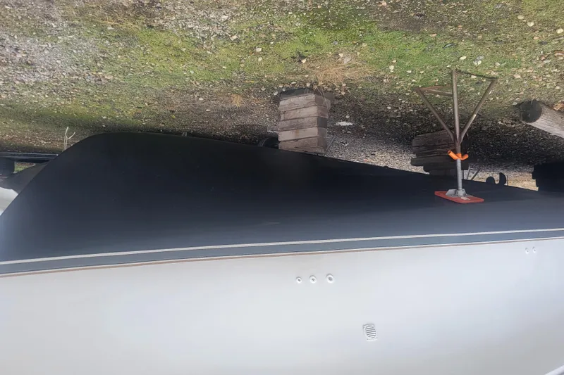 Slide: The Image of 1996 Carver 330 Mariner boat hull on dry dock with support stands. - 56