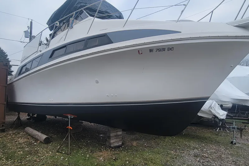 Slide: The Image of 1996 Carver 330 Mariner boat on stands, ready for maintenance or storage. - 59