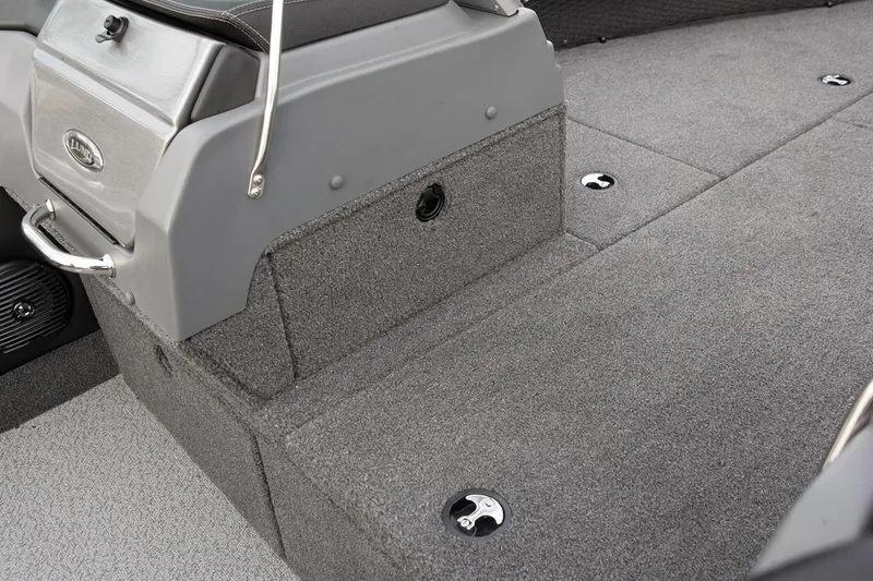 Slide: The Image of Manufacturer Provided Image: 2019 Lund 2175 Pro-V boat interior with gray carpeted flooring and storage compartments. - 12