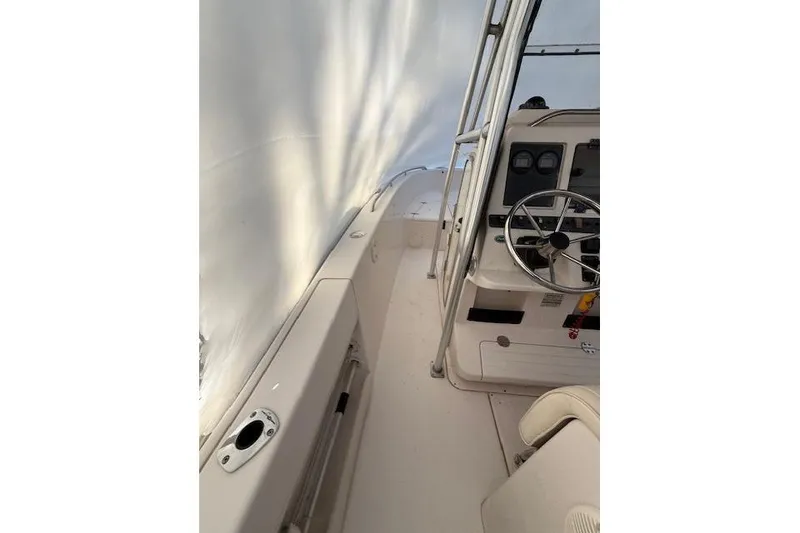 Slide: The Image of 2002 Grady-White Fisherman 222 boat interior with steering wheel and console. - 3