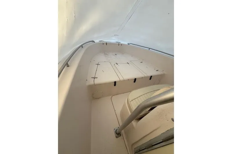 Slide: The Image of 2002 Grady-White Fisherman 222 boat interior with seating and storage compartments. - 4