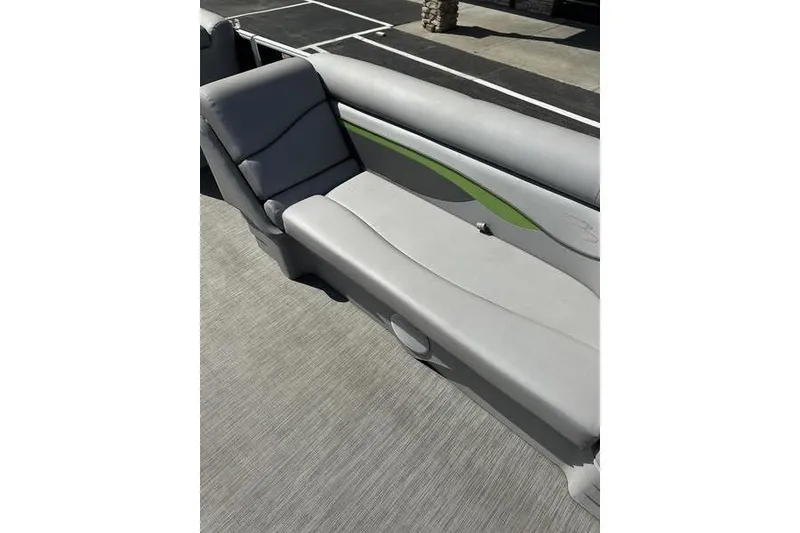 Slide: The Image of 2020 Bennington 21 SL boat interior with gray seating and green accent. - 12