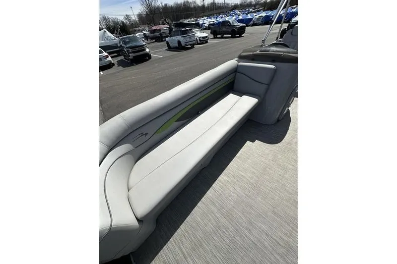 Slide: The Image of 2020 Bennington 21 SL boat interior with gray seating in a parking lot. - 5