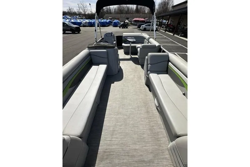 Slide: The Image of 2020 Bennington 21 SL pontoon boat interior with spacious seating and canopy. - 7