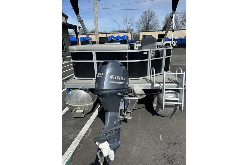 Slide: The Image of 2020 Bennington 21 SL pontoon boat with Yamaha 50 outboard motor in parking lot. - 9