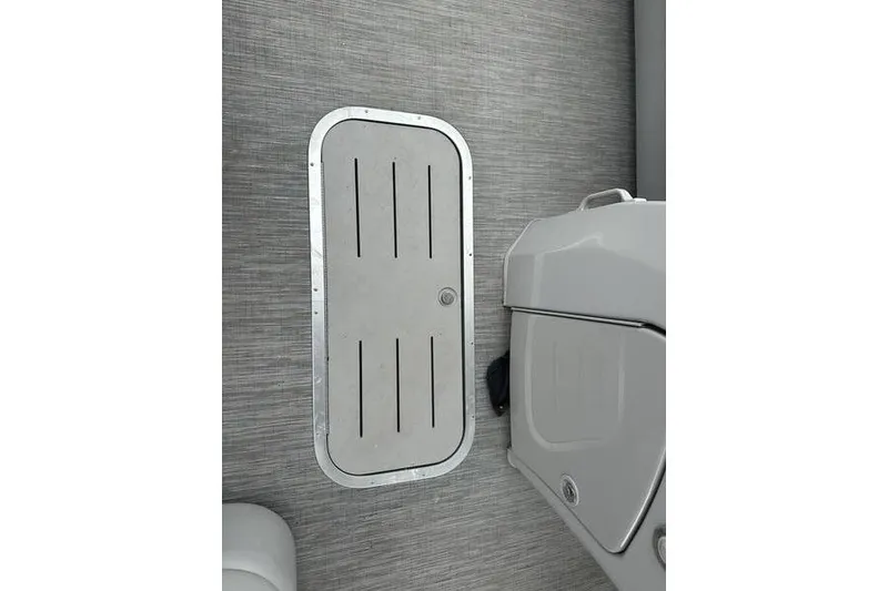 Slide: The Image of 2022 Bennington 24 LSBA boat interior with storage compartment and sleek design. - 11