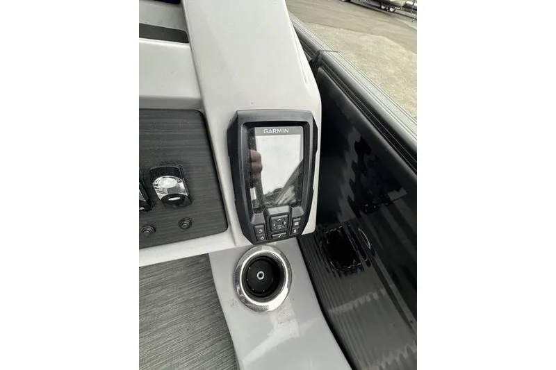 Slide: The Image of Garmin device on 2022 Bennington 24 LSBA boat dashboard, featuring sleek design and controls. - 16