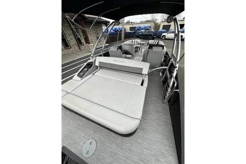 Slide: The Image of 2022 Bennington 24 LSBA pontoon boat with spacious seating and modern design. - 22
