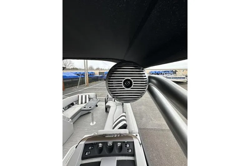 Slide: The Image of 2022 Bennington 24 LSBA boat interior with speaker and seating area. - 23