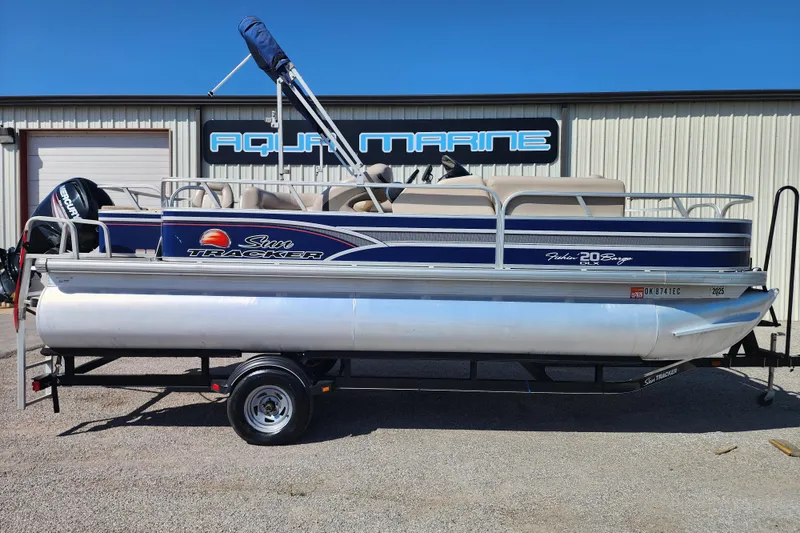 The Image of 2015 Sun Tracker Fishin' Barge 20 DLX pontoon boat on trailer at Aqua Marine. - 0