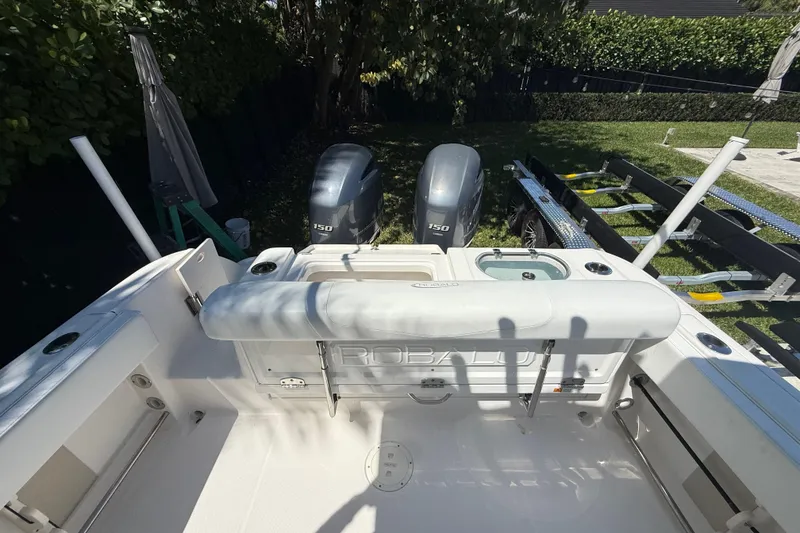 Slide: The Image of 2017 Robalo R242 Center Console boat with dual 150 horsepower engines. - 11