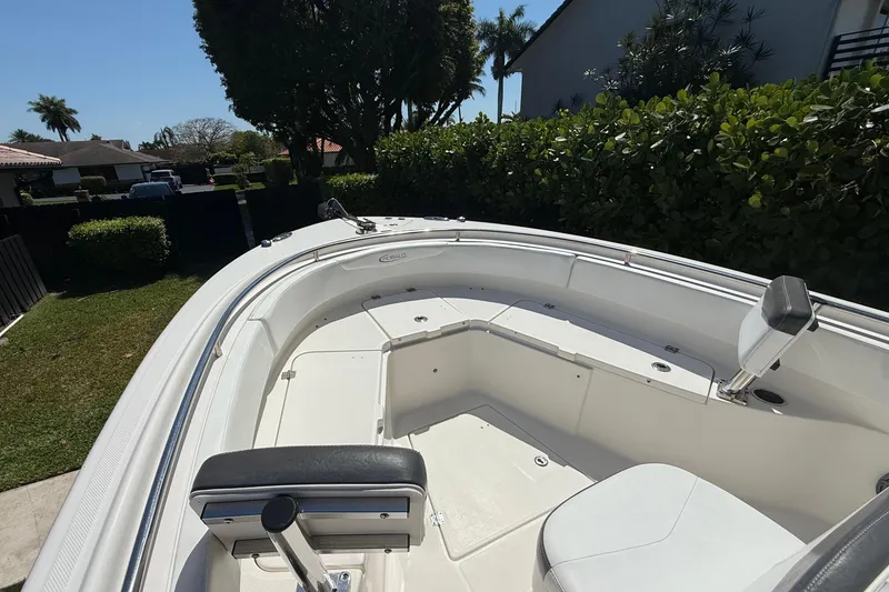 Slide: The Image of 2017 Robalo R242 Center Console boat parked in a garden. - 17
