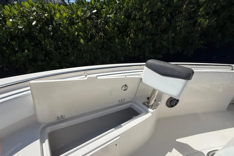 Slide: The Image of 2017 Robalo R242 Center Console boat with storage and seating. - 20