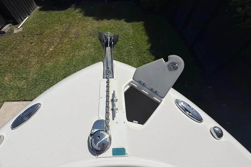 Slide: The Image of 2017 Robalo R242 Center Console boat anchor system on grassy background. - 21