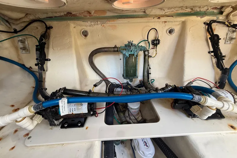Slide: The Image of 2017 Robalo R242 Center Console boat interior wiring and plumbing setup. - 28