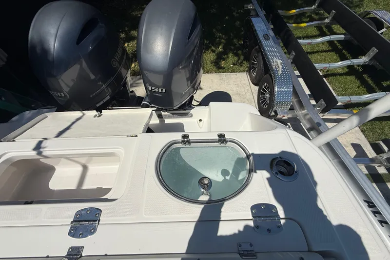 Slide: The Image of 2017 Robalo R242 Center Console boat with dual Yamaha 150 engines and trailer. - 9