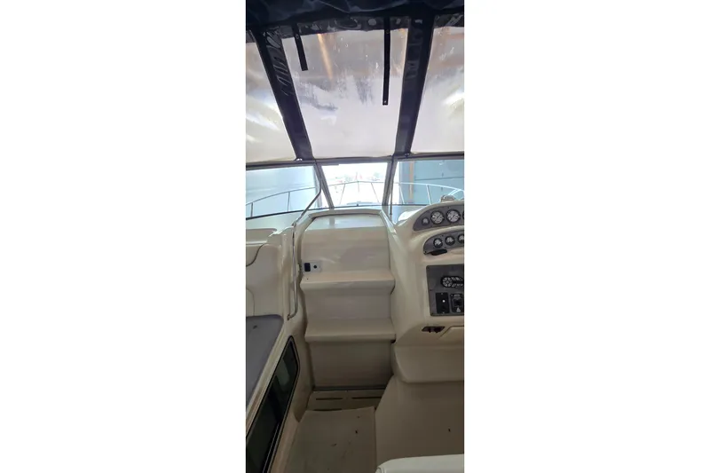 Slide: The Image of Interior view of a 2000 Monetery 302 Express boat cockpit with dashboard controls. - 10