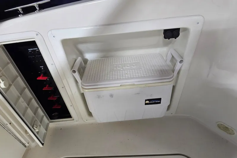 Slide: The Image of Boat interior with Igloo cooler and control panel, Monetery 302 Express, 2000 model. - 14