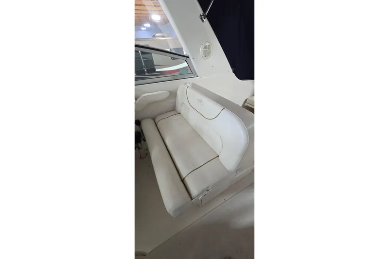 Slide: The Image of White seating area inside a 2000 Monetery 302 Express boat. - 18