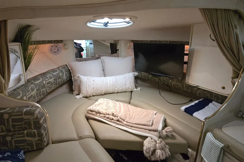 Slide: The Image of Luxurious interior of a 2000 Monetery 302 Express boat with cozy seating and decor. - 26