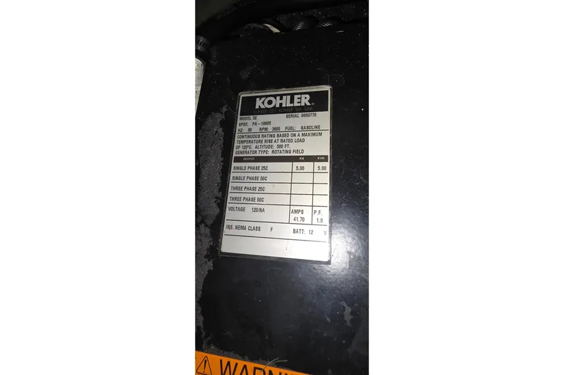Slide: The Image of Label on Kohler generator, model 5E, detailing specifications and output information. - 40