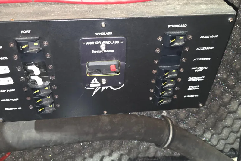 Slide: The Image of Control panel of a 2000 Monetery 302 Express boat with switches and labels. - 41
