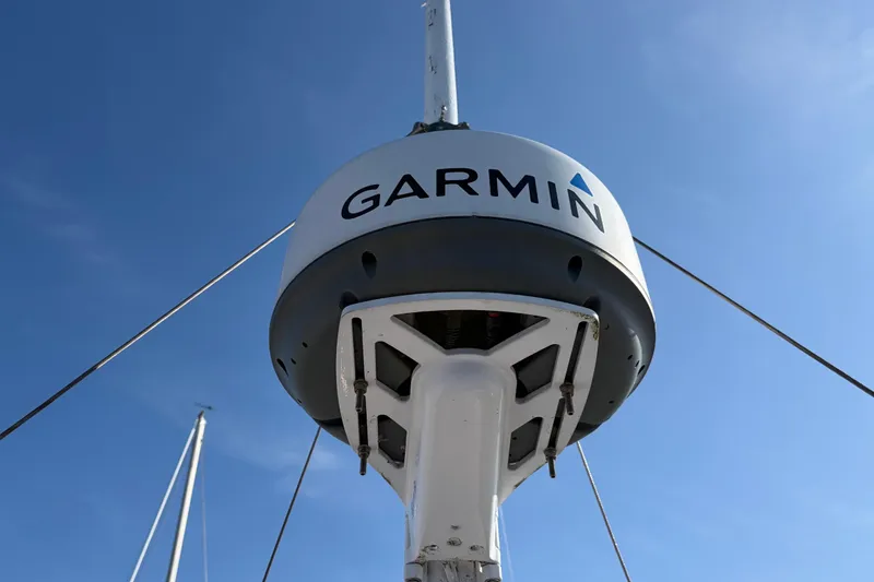 Slide: The Image of Garmin radar on 1985 Albin 36 Trawler against clear blue sky. - 12