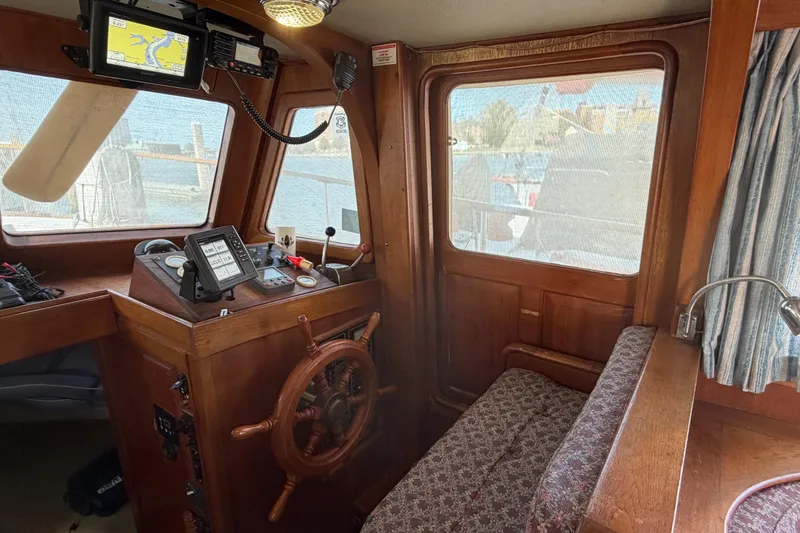 Slide: The Image of Interior of 1985 Albin 36 Trawler with wooden helm and navigation equipment. - 18
