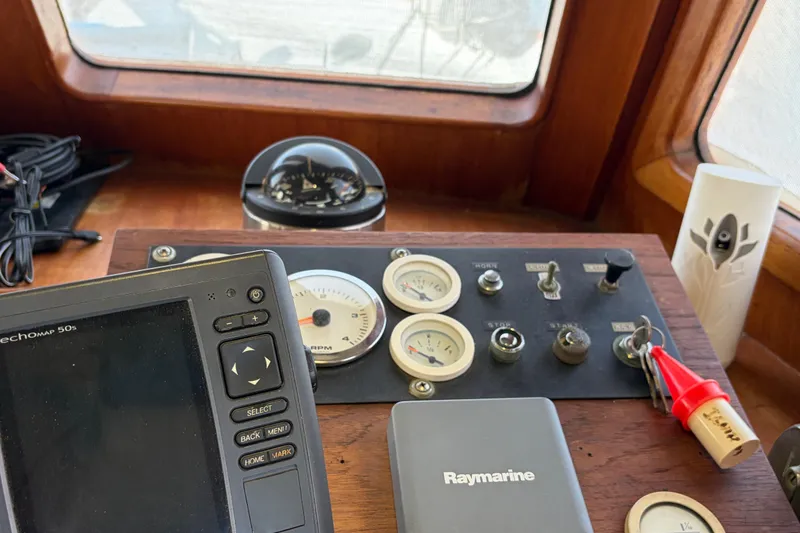 Slide: The Image of Control panel of a 1985 Albin 36 Trawler with navigation instruments and gauges. - 29