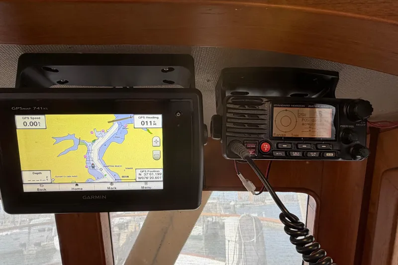 Slide: The Image of Navigation equipment on a 1985 Albin 36 Trawler, featuring Garmin GPS and radio system. - 33