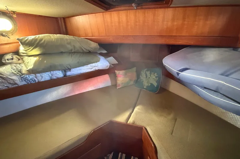 Slide: The Image of Cozy cabin interior of 1985 Albin 36 Trawler with bedding and cushions. - 37