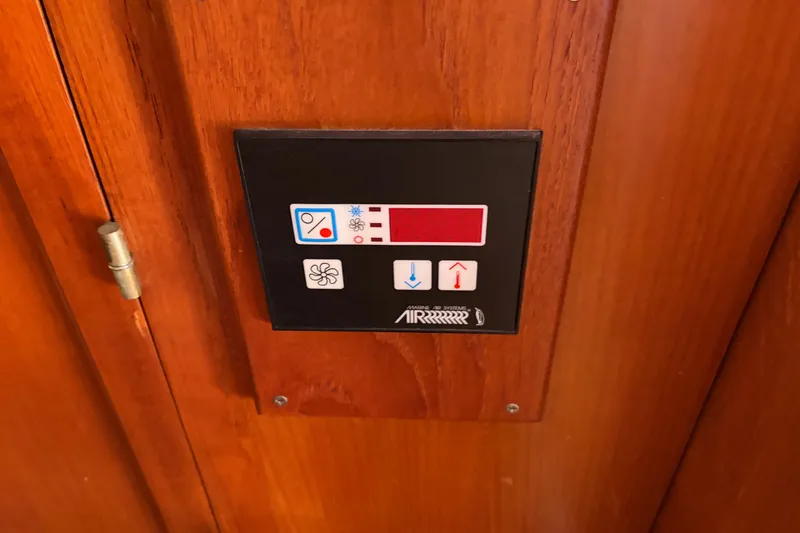 Slide: The Image of Control panel on 1985 Albin 36 Trawler's wooden interior wall. - 38