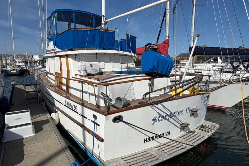 Slide: The Image of 1985 Albin 36 Trawler docked in Hampton, VA, featuring blue canvas covers. - 4